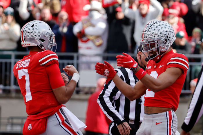 Nov 20, 2021; Columbus, Ohio, USA; Ohio State Buckeyes wide receiver Chris Olave (2) celebrates with Ohio State Buckeyes quarterback C.J. Stroud (7) after he scores a touchdown in the first half against the Michigan State Spartans at Ohio Stadium.